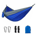 Blue parachute nylon outdoor hammock hung between trees, showing its 270cm length.