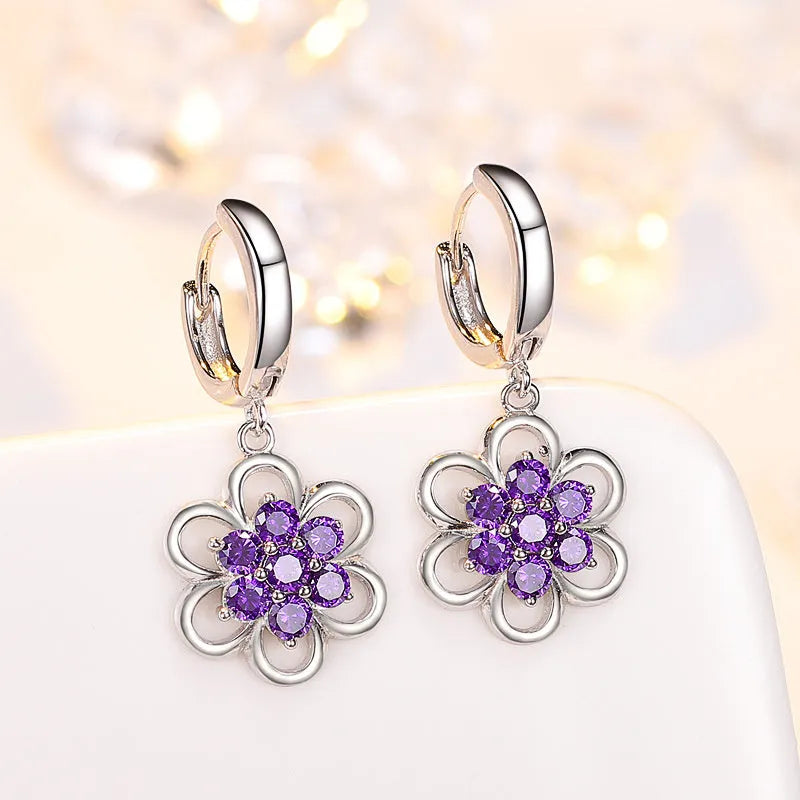 Floral white copper earrings with faceted stone accent, available as ear stud or ear hook in purple or white colour options
