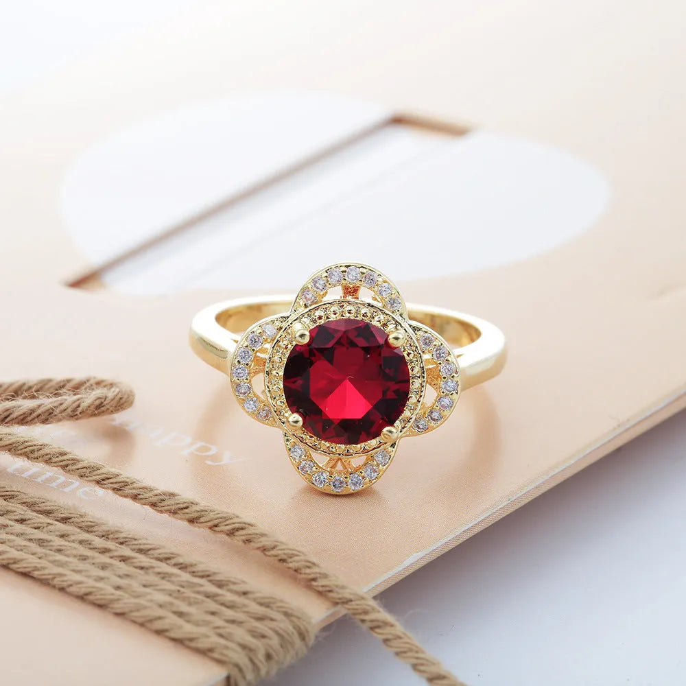 Close-up of a copper fruit-shaped ring with a central zircon stone in colour 10-6-1395.
