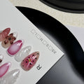 Set of hand-painted 3D carved nail beauty patches in embossed and candy patterns on a plastic sheet.