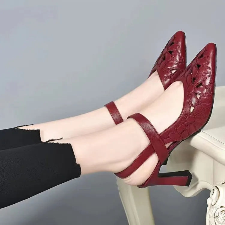 Women's pointed toe sandals with hollowed toe box in black, red, and creamy-white on a rubber sole.