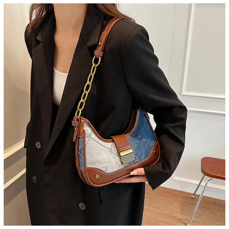 Brown denim women's bucket shoulder bag with diamond mesh panels and chain straps