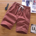Men's thin cotton summer shorts in various colours on a middle waist model, showing lace-up placket detail.