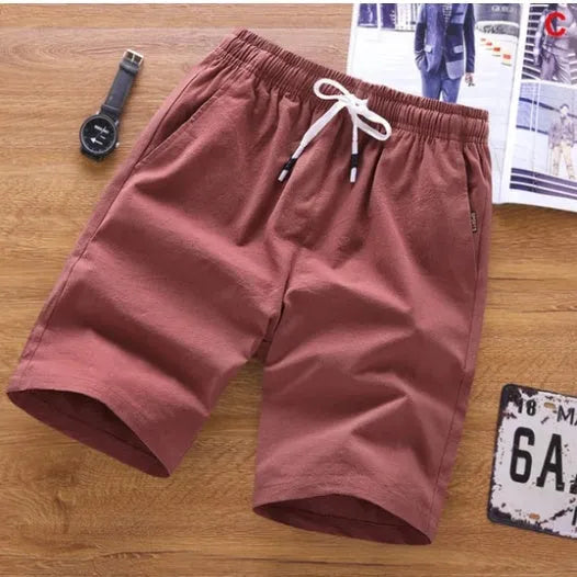 Men's thin cotton summer shorts in various colours on a middle waist model, showing lace-up placket detail.