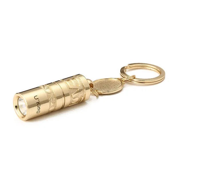 Gold-coloured zinc alloy die-cast LED keychain flashlight with attached key ring.