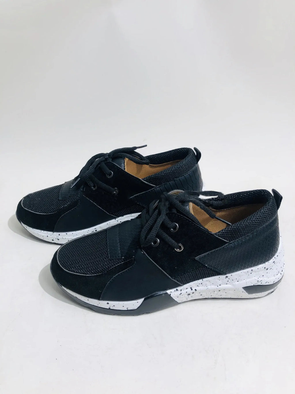 Women's suede casual flat sneakers with a wedge heel in leopard print.