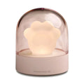 Grey cat paw shaped USB rechargeable night light with musical features on wooden desk