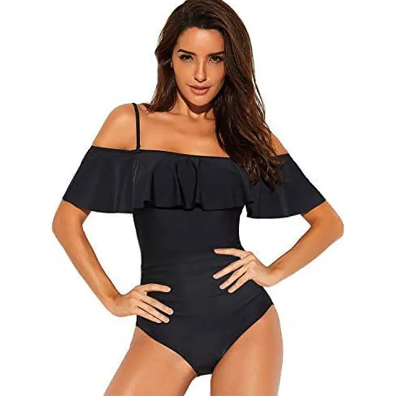 Black one-piece cut-out swimsuit with ruffled straps and tube top style.