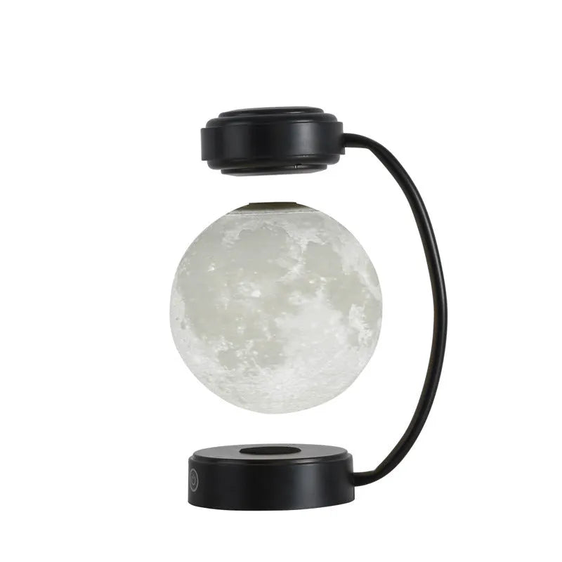 3D LED moon night light with magnetic levitation, floating ball, iron base, black finish on a desk