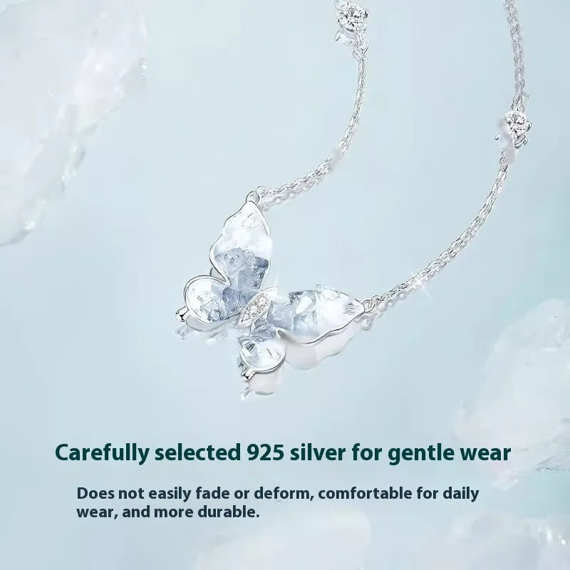 Close-up of a silver Bingyu butterfly pendant necklace on an adjustable O-ring chain.