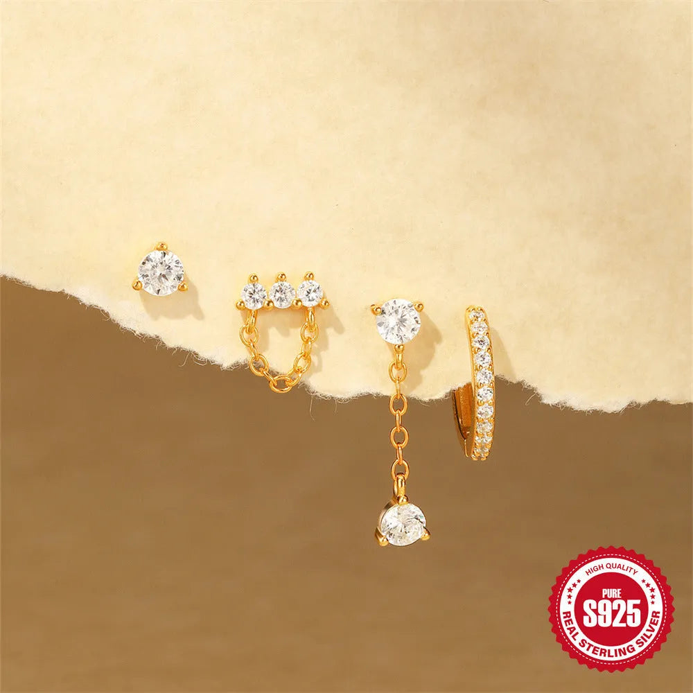 Close-up of geometric S925 sterling silver earrings with a gold electroplated clover petal design.