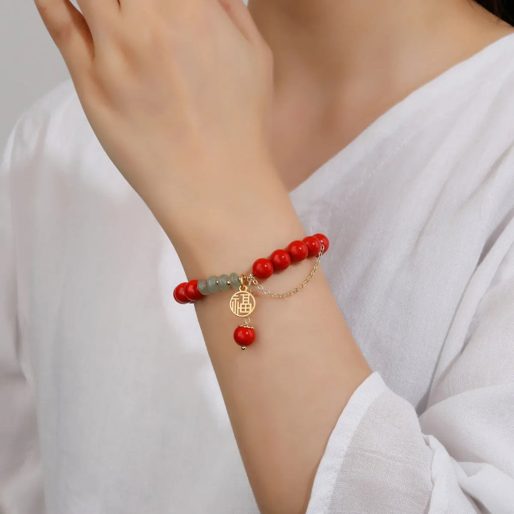 Retro women's red sand cinnabar bracelet with carved fu character and jade spacer