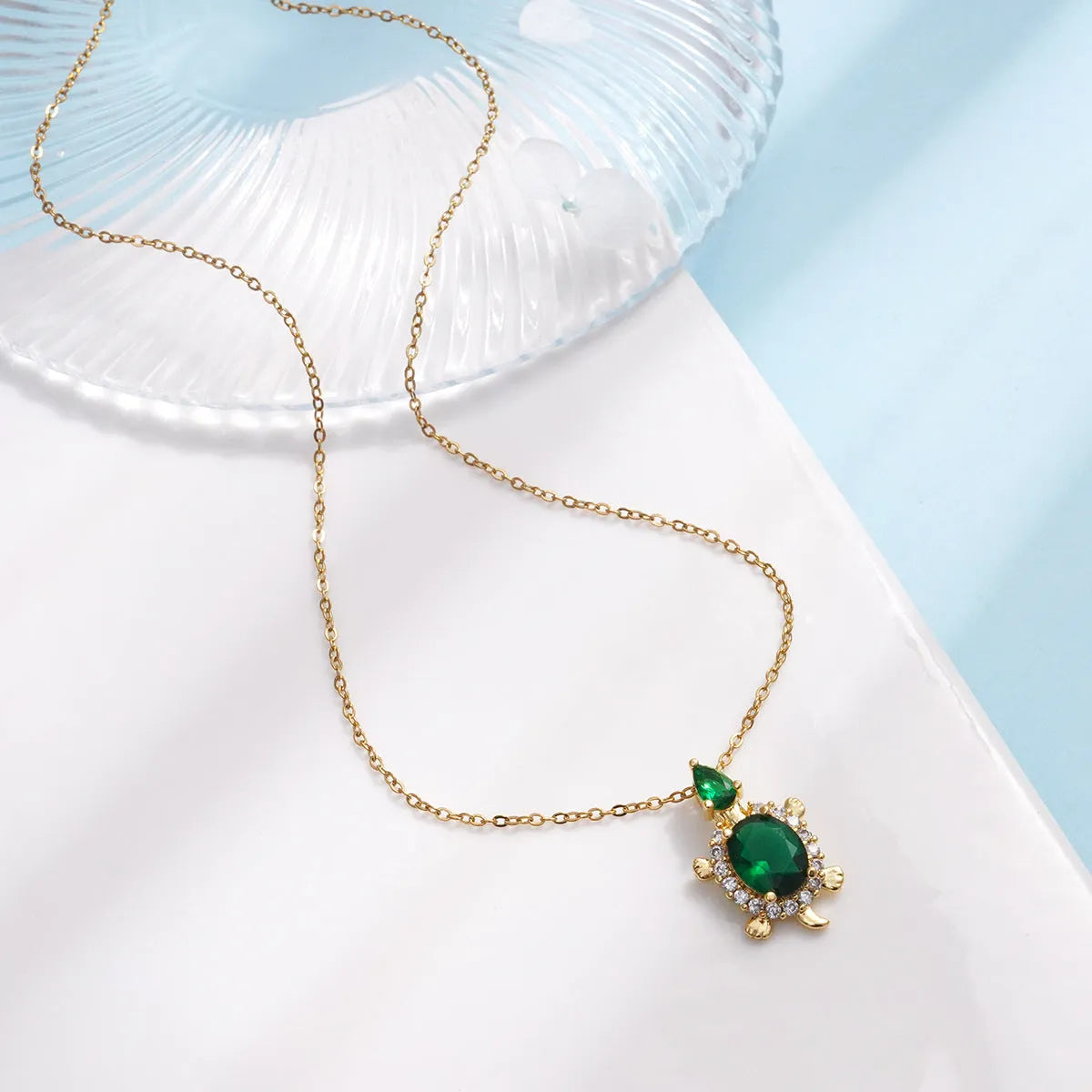 Gold-plated copper sea turtle necklace with zirconium accents and mixed gemstone inlay, O-link chain, light luxury style for women