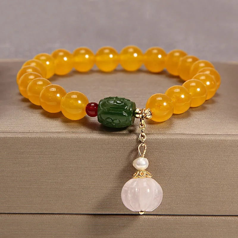 Women's yellow agate crystal bracelet with gold silk cord in adjustable khaki design