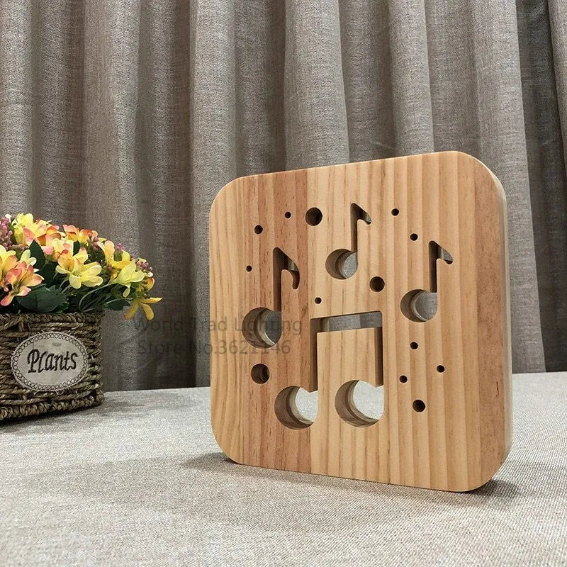 A cubic wooden LED atmosphere lamp with warm white light, shown with a USB cable.