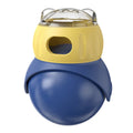 Yellow and blue owl-shaped plastic tumbler cat puzzle feeder toy on a plain background.