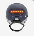 Cycling helmet with integrated automatic LED brake light on rear, shown in available style options