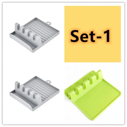 Green silicone kitchen utensil holder with four holes holding spatula, spoon, knife, and chopsticks on countertop