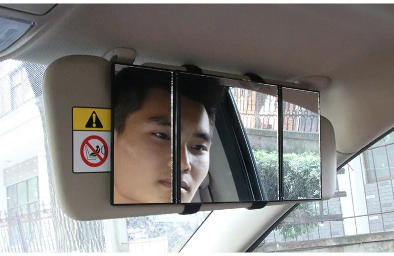 Silver portable car folding mirror shown both closed and opened on a flat surface.