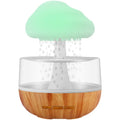 White cloud-shaped humidifier with colour-changing night light and USB cable.