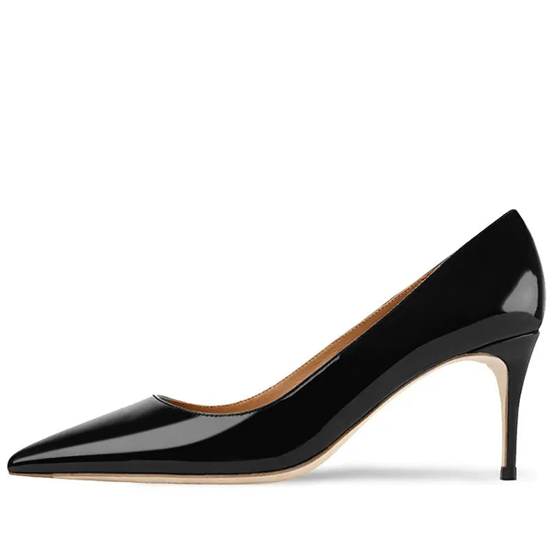 Women's black pointed toe slip-on pump with a kitten heel on a soft rubber sole.