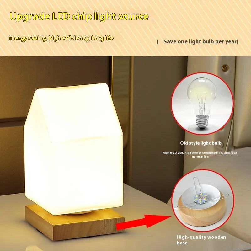 White Nordic solid wood USB table lamp with touch dimming in cube shape on a wooden table.