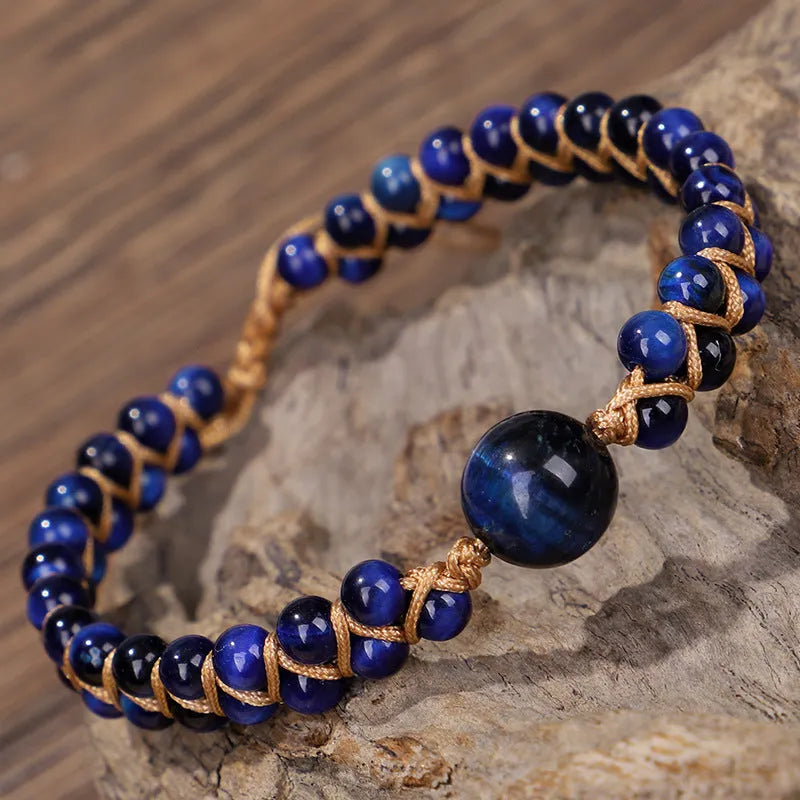 Hand-woven geometric pull bracelet with tigereye stone beads in blue or amethyst colour