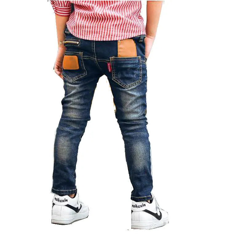 Boys stretch denim pants in denim blue with zipper pocket, soft cotton fabric