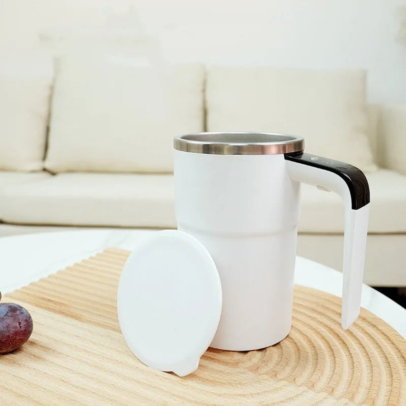 White automatic electric stirring cup with LCD screen and USB charging cable.