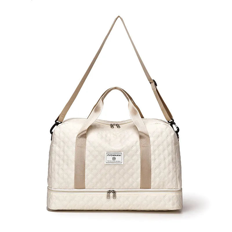 Large Oxford cloth travel holdall in a solid colour, shown with a capacity of 36-55 litres for buggies and luggage.