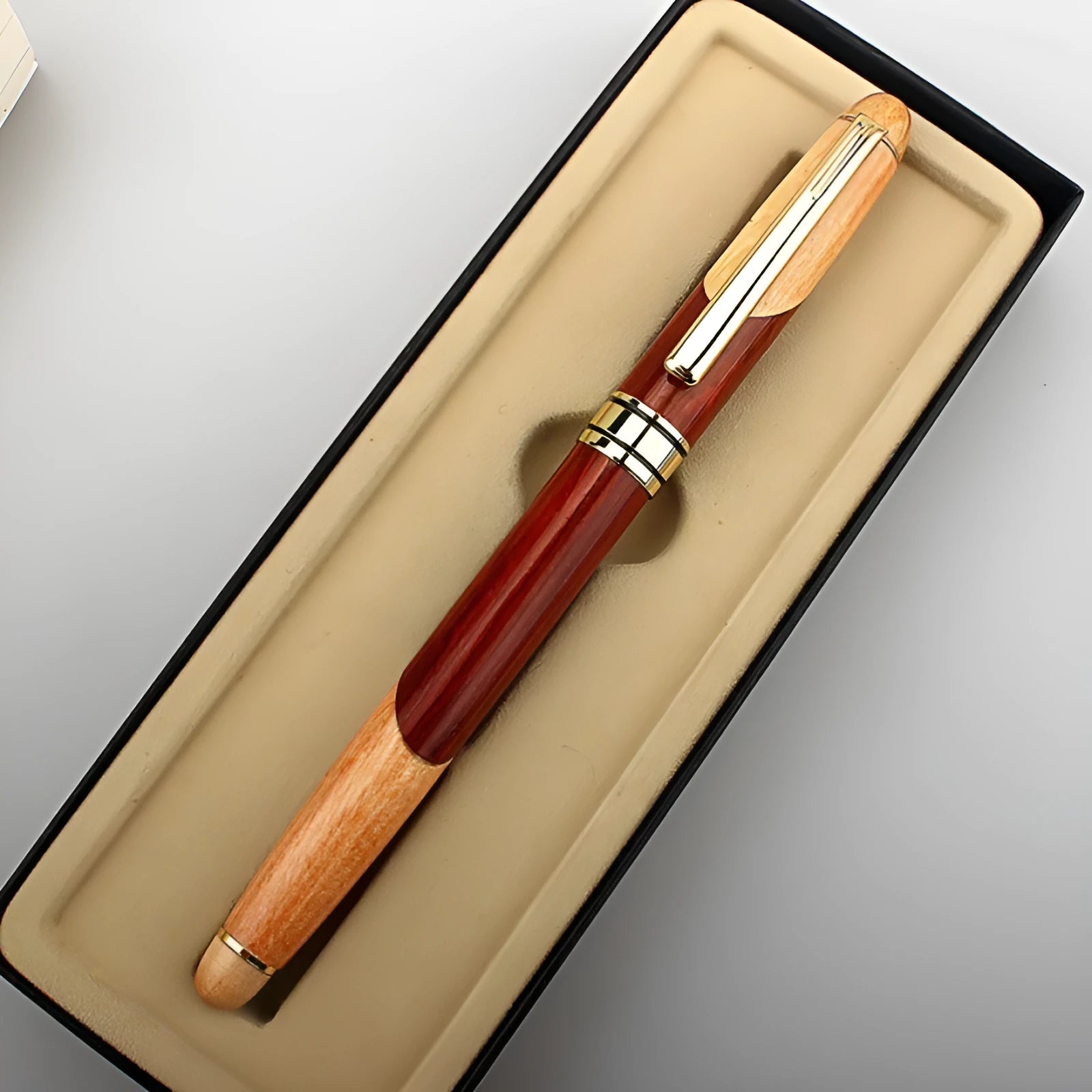 Wooden ballpoint pen with metal mechanism and presentation sleeve