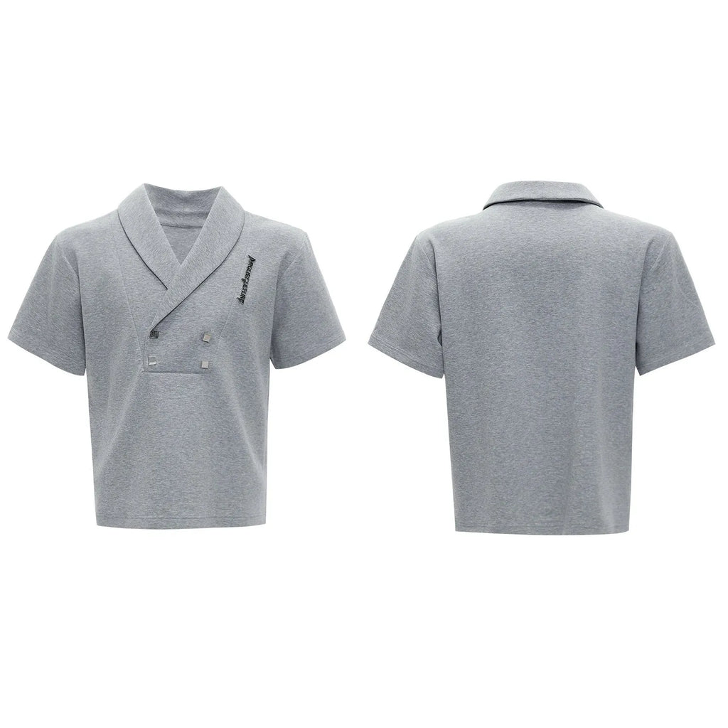 Men's dark grey cotton sports suit with V-neck jacket, padded shoulders, metal embellishments, and matching shorts.