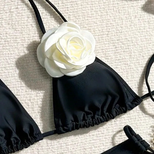 Black women's two-piece bikini with 3D floral lace detail on drawstring waistband, backless design.
