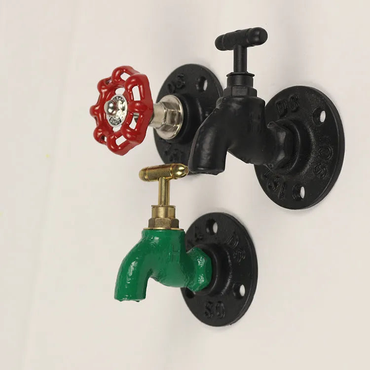 Water pipe style metal wall hook for towels on a white wall, shown in black, green, and red colour options.