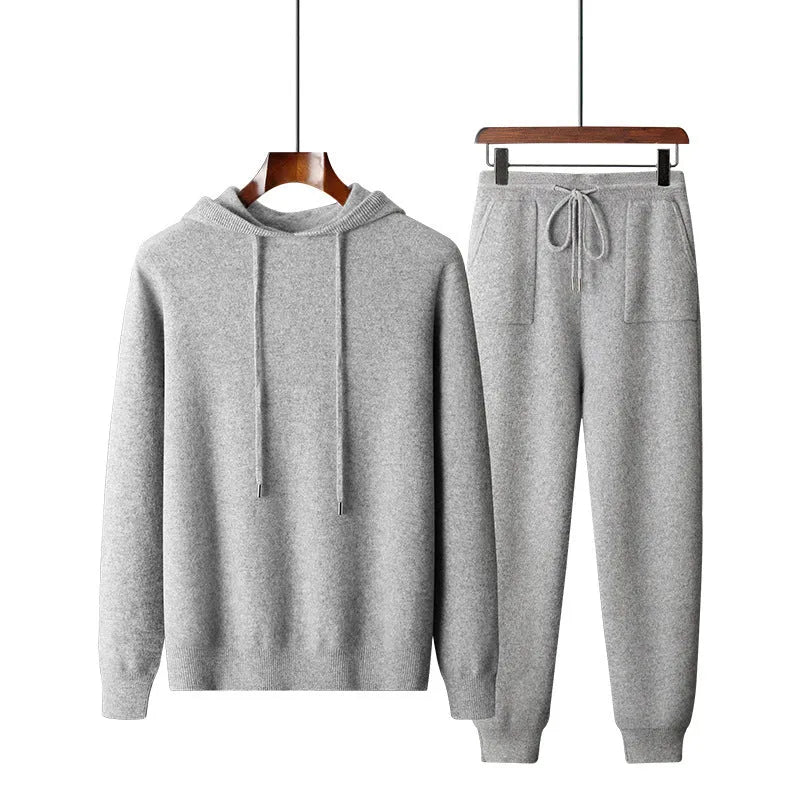 Men's light grey cashmere hooded sweatshirt and matching trousers laid flat.
