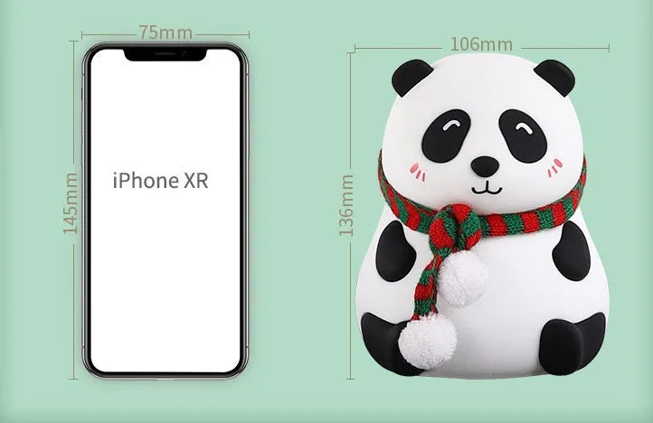White panda-shaped silicone night light with black accents, showing its compact size and soft LED glow.