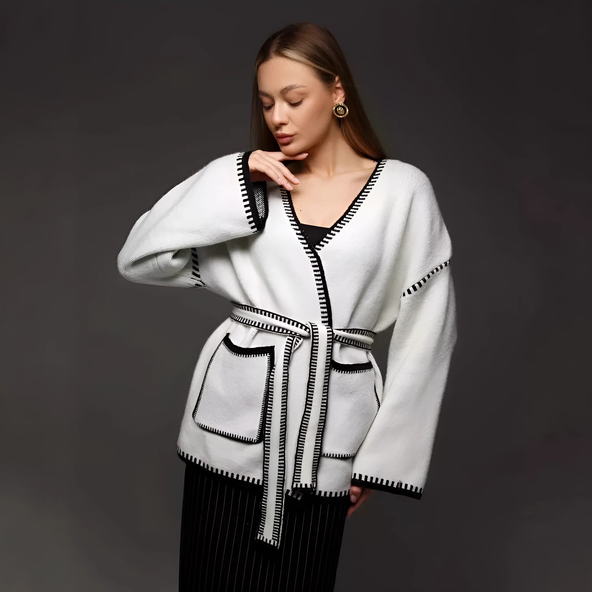 Loose fit lace-up front knitted cardigan in black, camel, or white colours.