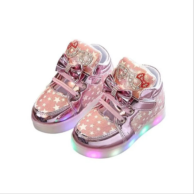 LED magic button sneakers in golden, pink, and silvery metallic finishes with illuminated soles