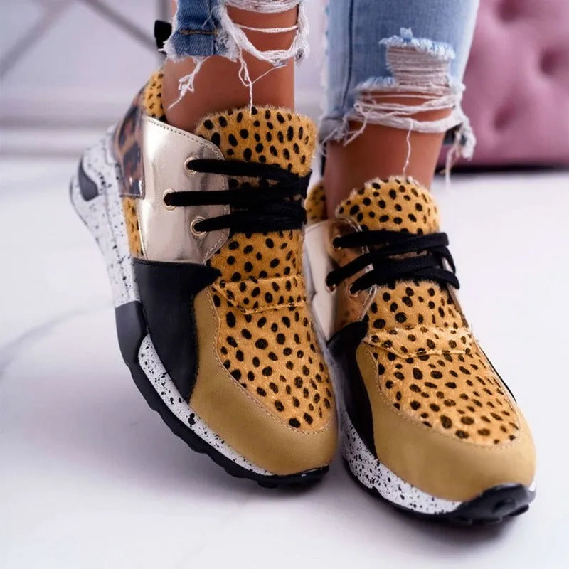 Women's suede casual flat sneakers with a wedge heel in leopard print.