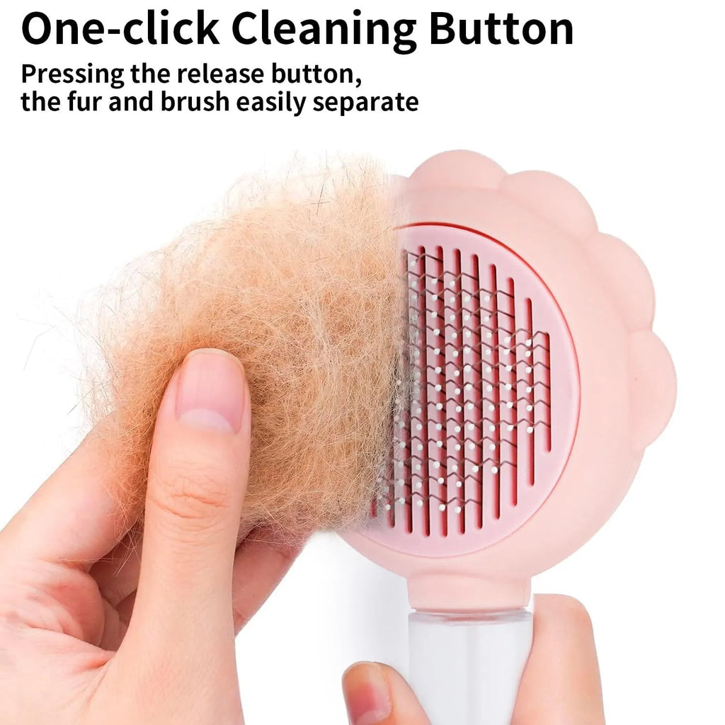 Grey spray cat brush with release button and stainless steel bristles for pet grooming.