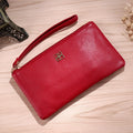 Long 55-inch black PU leather phone wallet handbag with a zipper, showing sewing line detail.