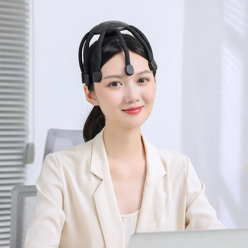 Black eight-claw head massager with flexible silicone tips and USB cable.