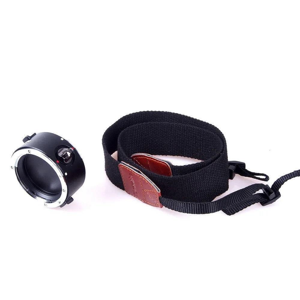Aluminium alloy camera lens flipper holder for Nikon E-Mount with stainless steel buckle and cotton strap.