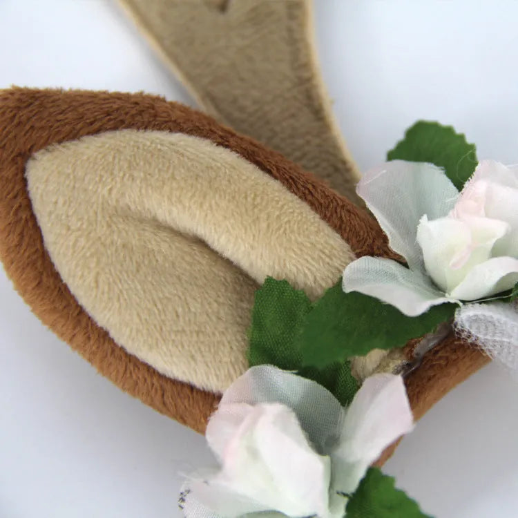 Christmas pet hat with short plush silk flower decoration on a small dog, available in three sizes