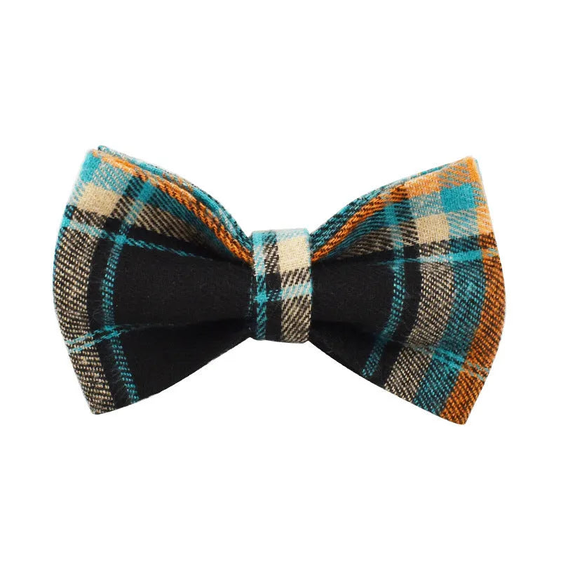 Green retro style cloth dog collar, leash, vest, and decorative bow set laid out flat.
