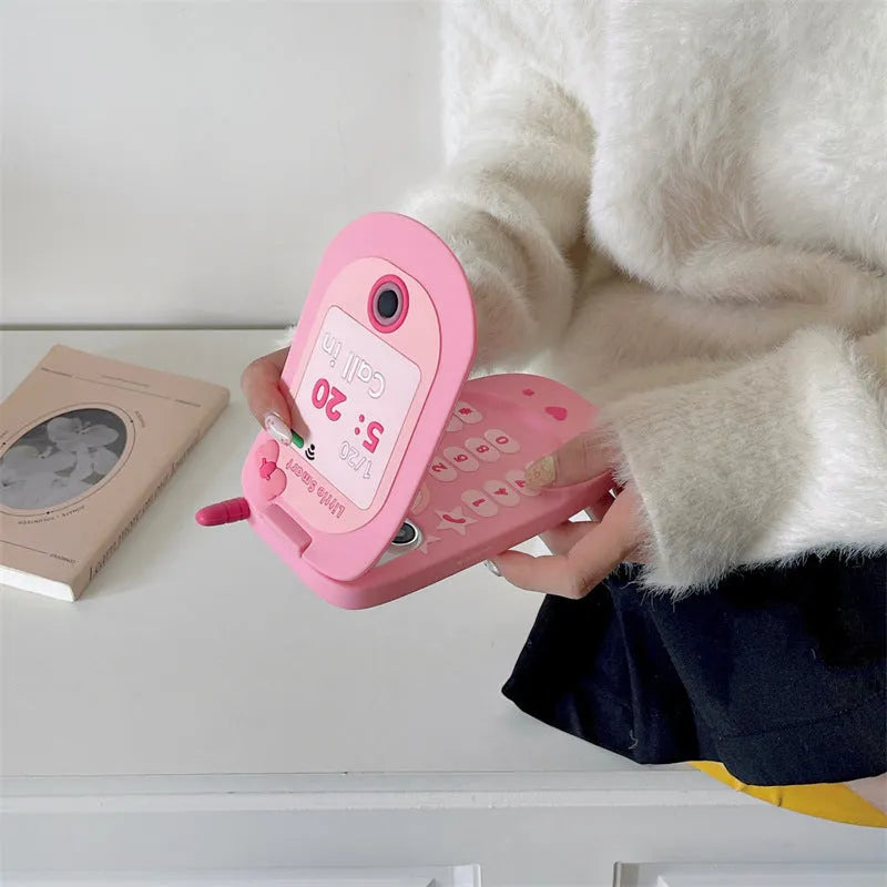 Light pink silicone flip phone case with a built-in mirror, shown next to a rose red version.