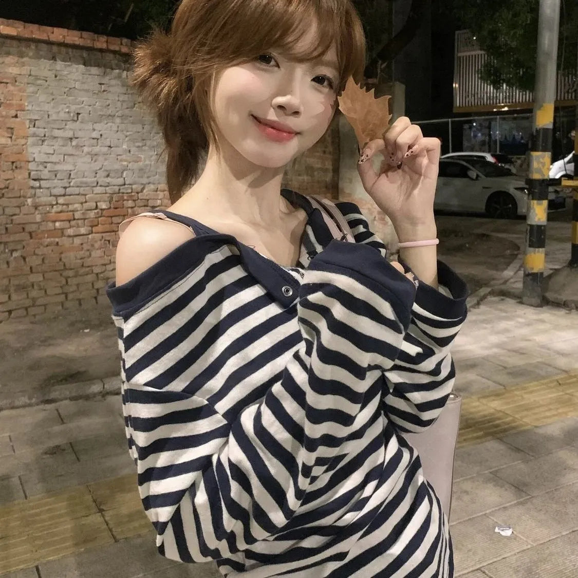 Dark blue women's oversized long-sleeve t-shirt with Korean style, embroidery, and stripe details.