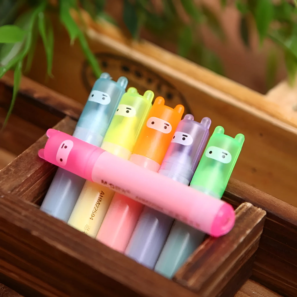 Set of six plastic highlighter pens with oblique chisel tips in different fluorescent colours.