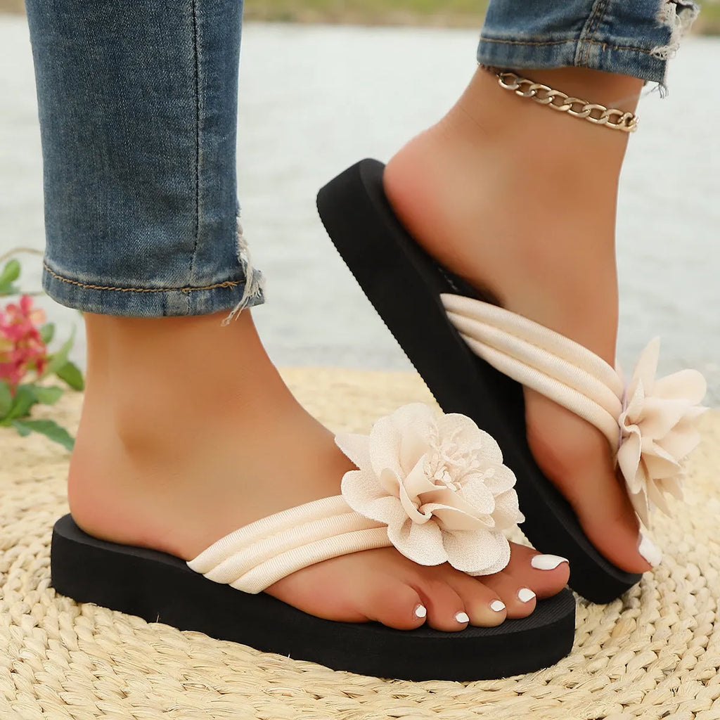Women's floral flip-flop sandals in beige with a lightweight EVA sole.