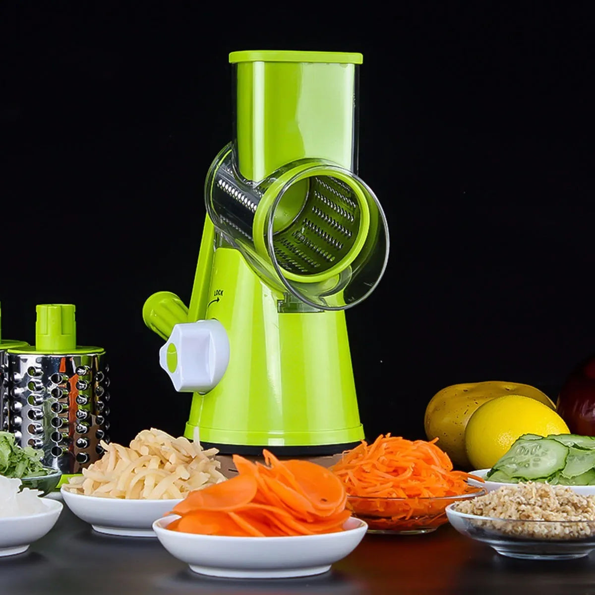 Blue green mandoline vegetable slicer with suction cup base and three stainless steel blades.